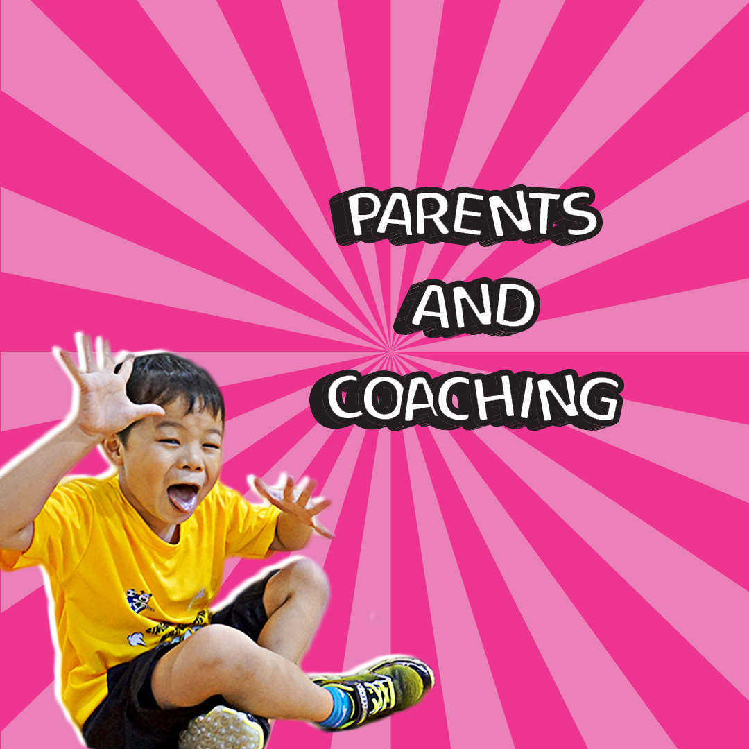 A father cheering from the sidelines while his daughter dribbles a ball during a multi-sports class.