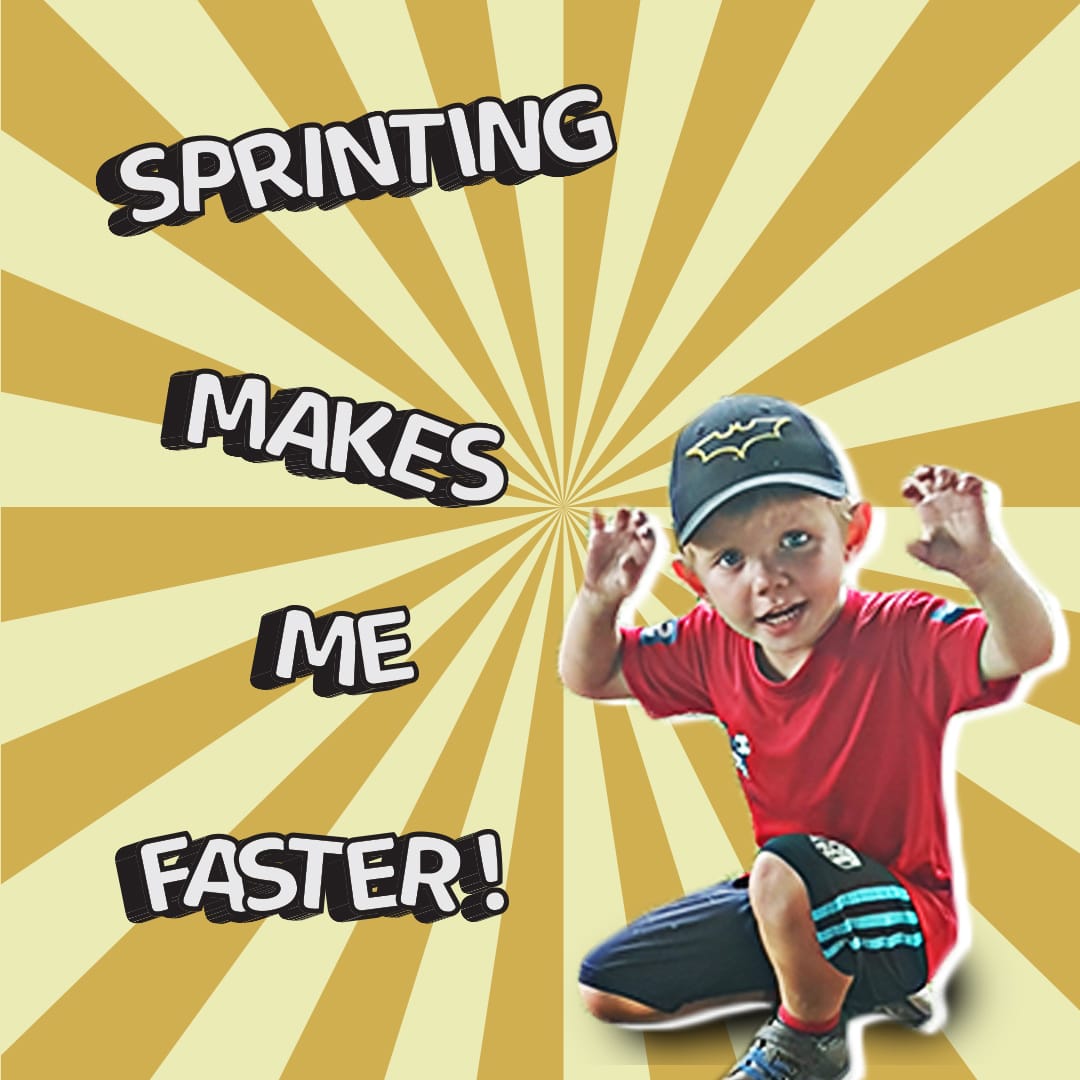 A determined young boy sprinting down a red track with a focused and happy expression.