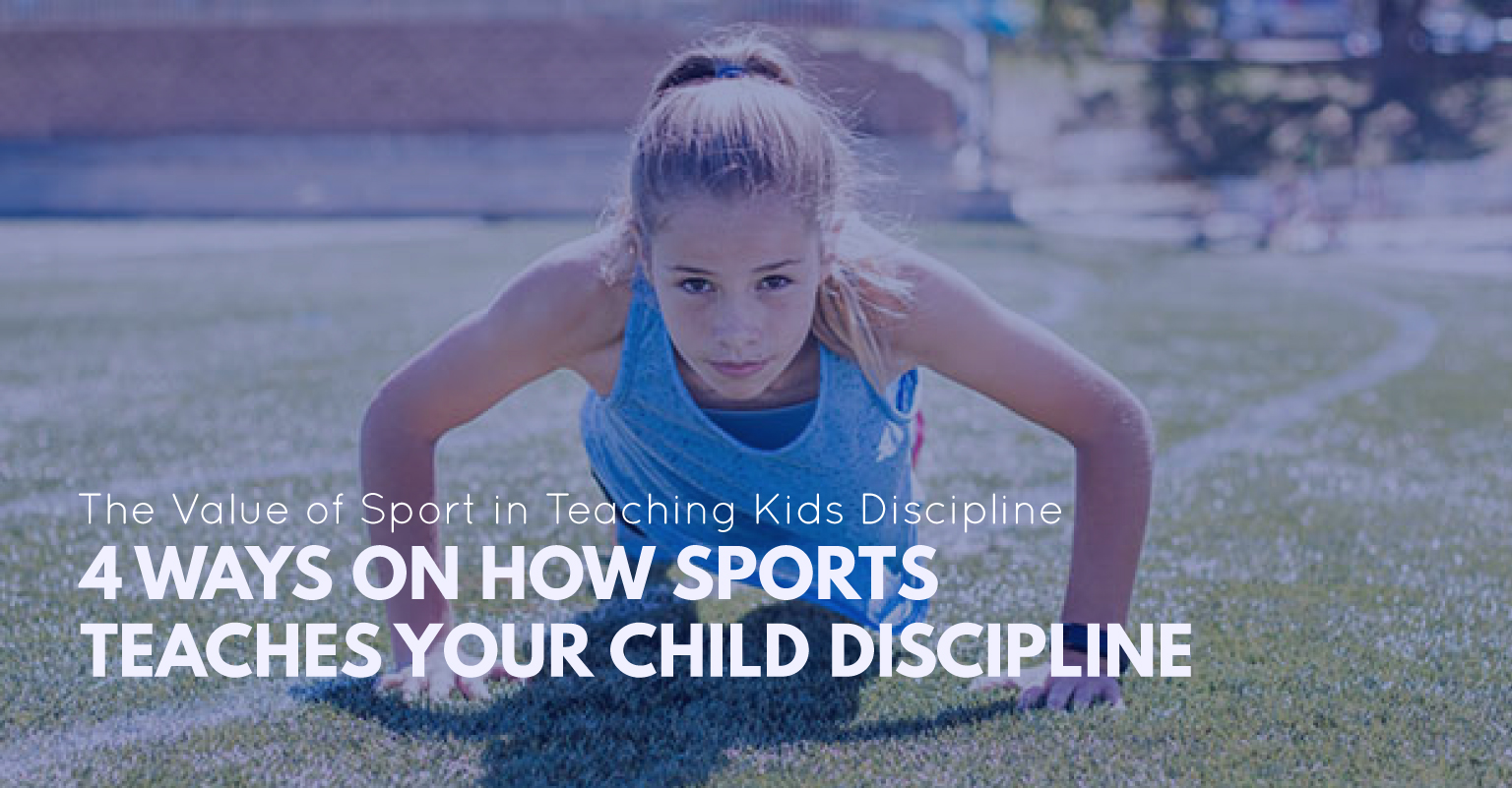 Young gymnast standing at attention and listening intently to a coach's instructions.