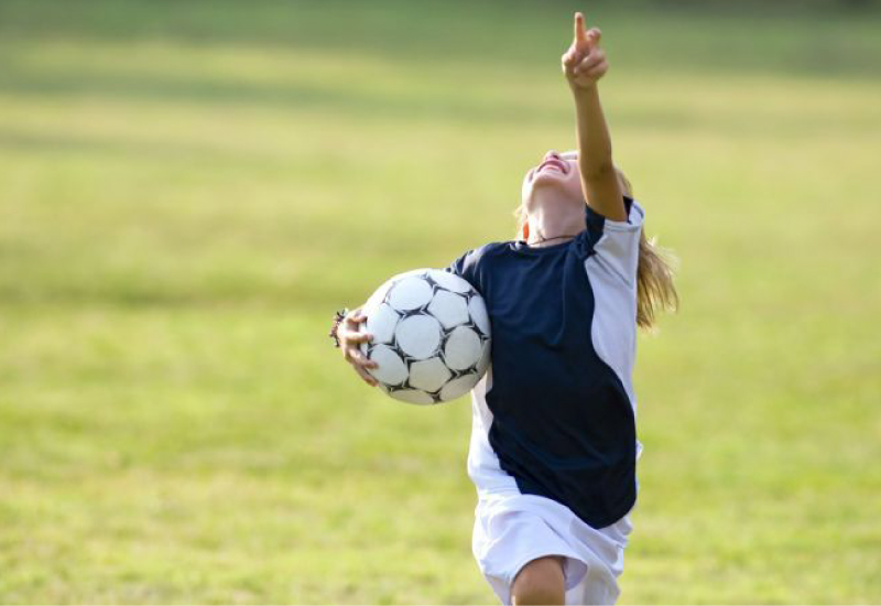 kid trying his best in sports