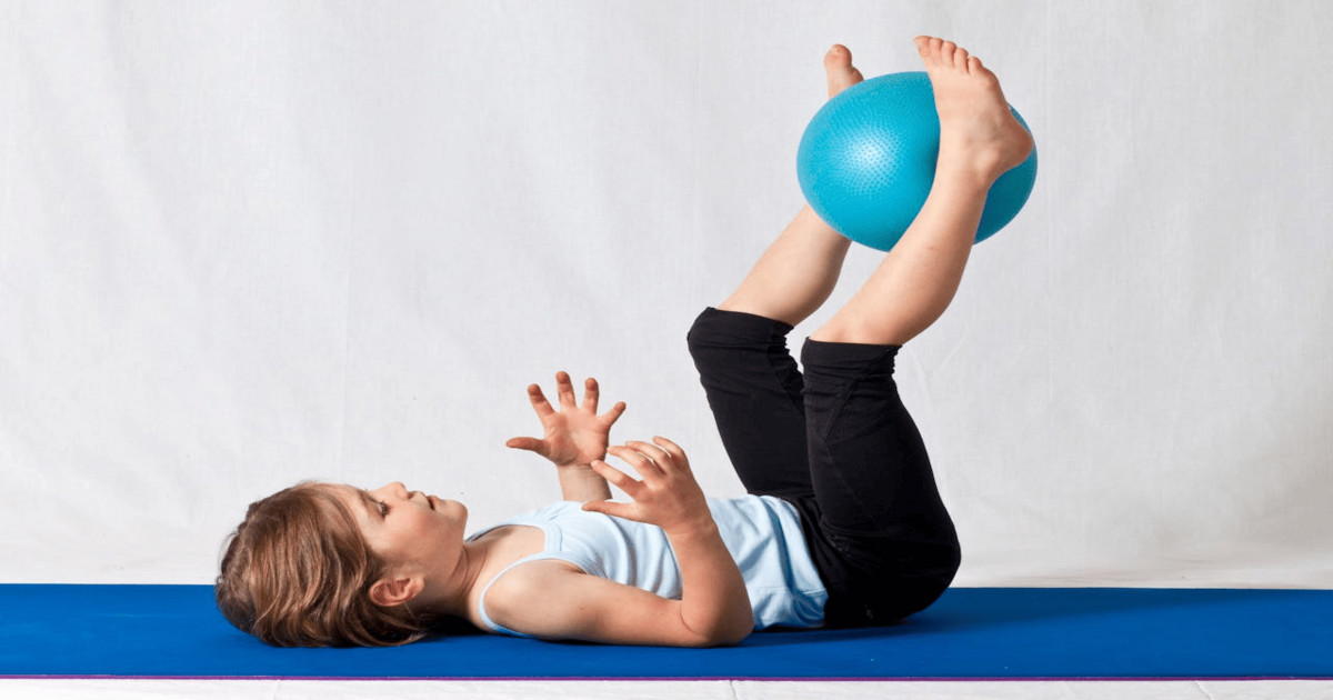 Children participating in a modern, tech-integrated fitness circuit in a sleek Hong Kong gym.